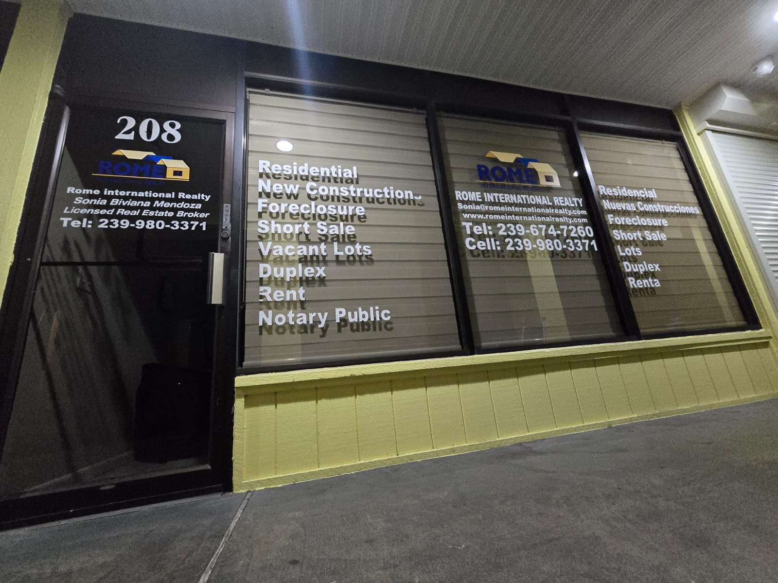front store of Rome International Realty Before Lightbox Sign Brand Identity